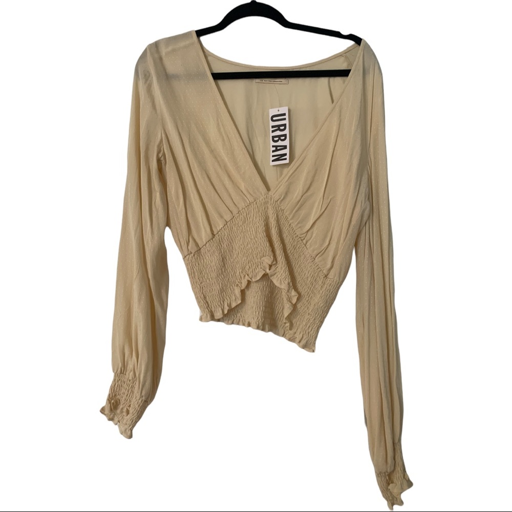 Urban Outfitters creme colored chiffon/sinched V neck top. Size Large.